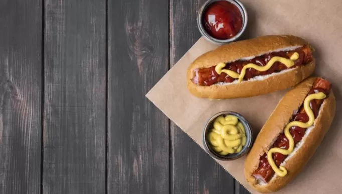 top-view-two-hot-dogs-with-ketchup-copy-space_23-2148655641